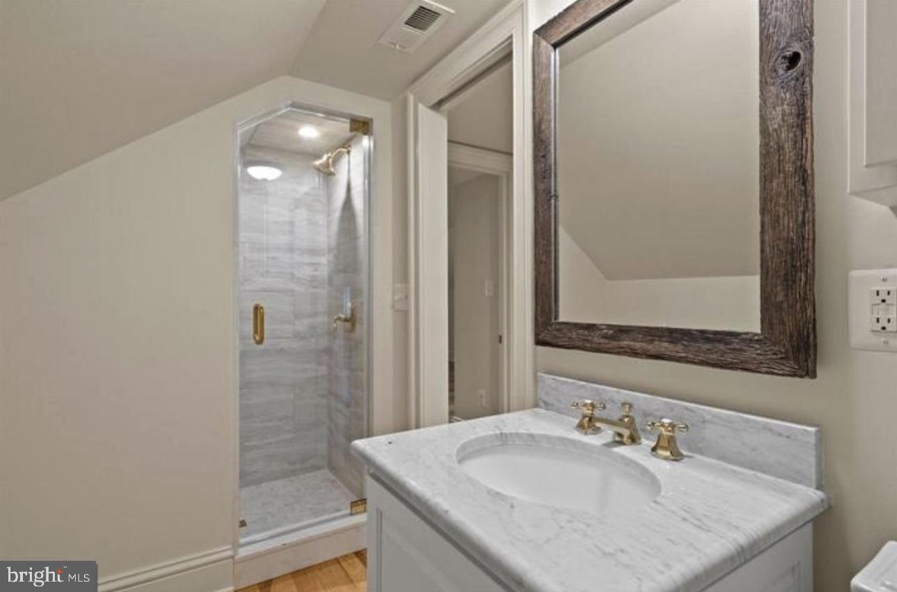 16131 Old York Road Monkton, MD 21111 - Photo 25 of 31 a bathroom with a granite countertop sink a mirror and shower