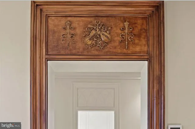 a view of a hallway with wooden floor and entryway