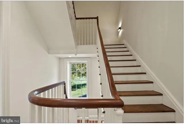a large kitchen with white cabinets