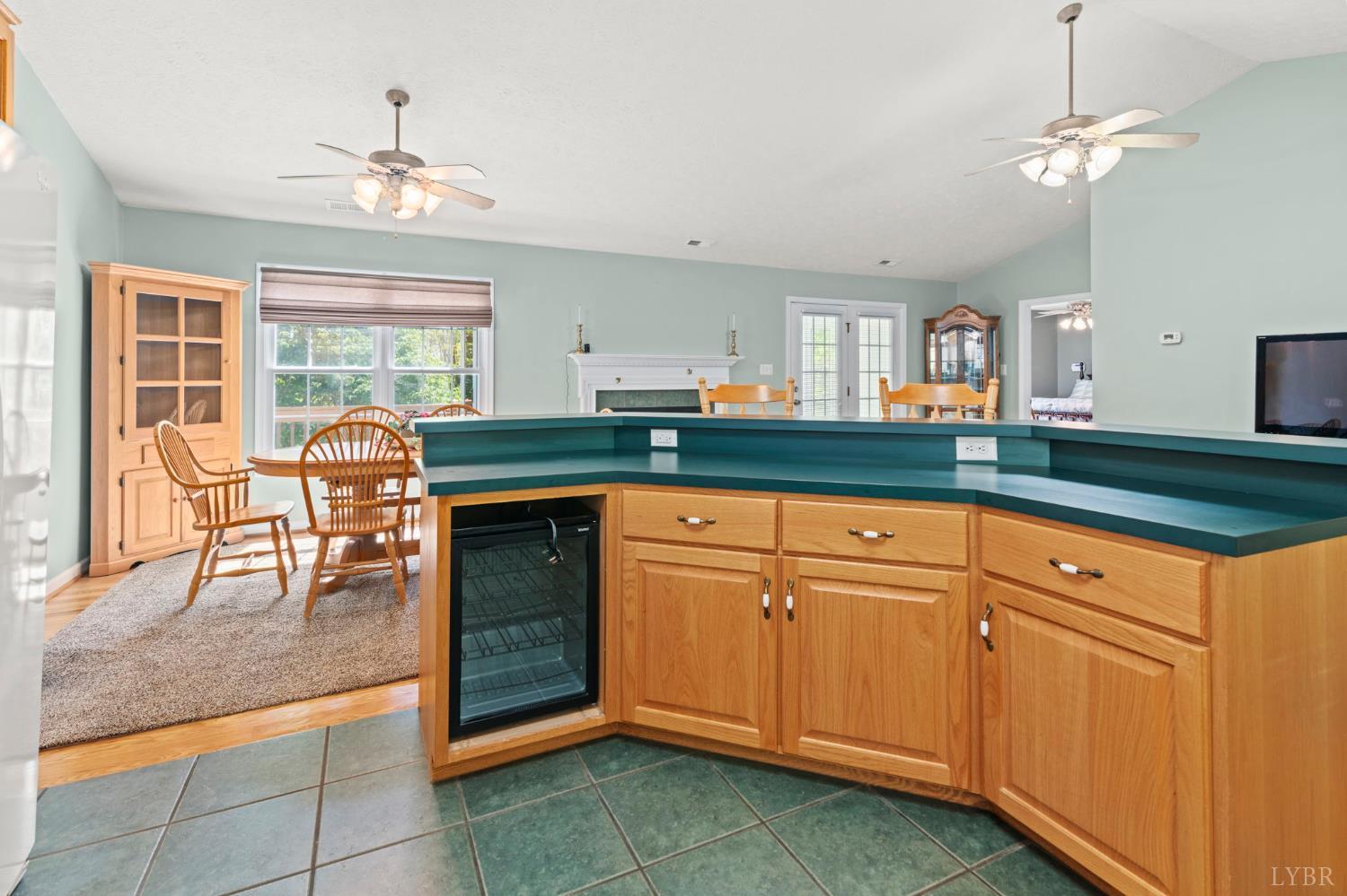 298 Braxton Ridge Road Amherst, VA 24521 - Photo 10 of 65 a kitchen with granite countertop white cabinets and stainless steel appliances