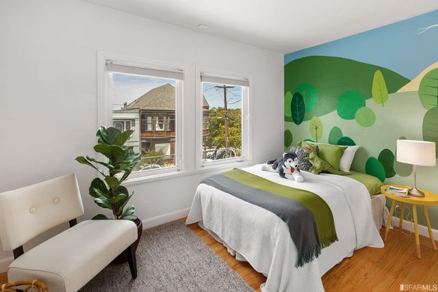 a bedroom with a bed and a dresser