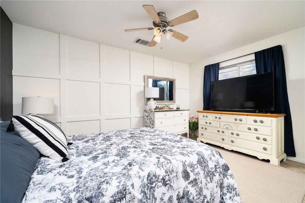 7575 Rancho Road Pinon Hills, CA 92397 - Photo 12 of 38 a bedroom with a bed and a flat screen tv