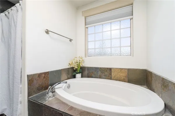 a white bath tub sitting in a bathroom