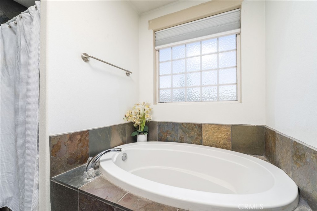 7575 Rancho Road Pinon Hills, CA 92397 - Photo 23 of 38 a white bath tub sitting in a bathroom