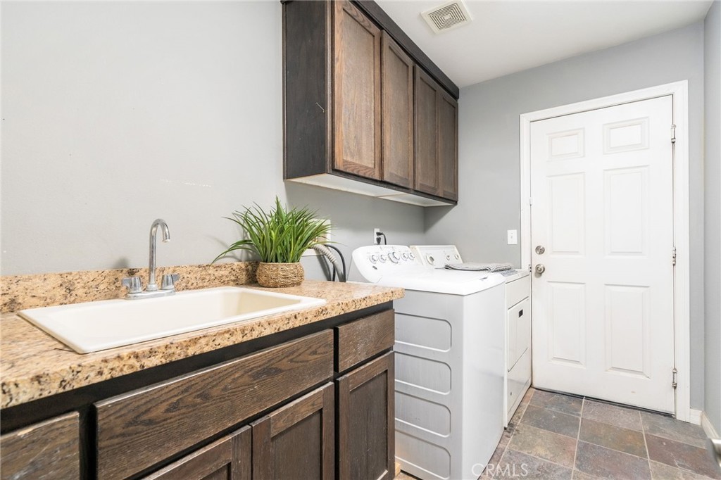 7575 Rancho Road Pinon Hills, CA 92397 - Photo 25 of 38 a bathroom with a sink and a mirror