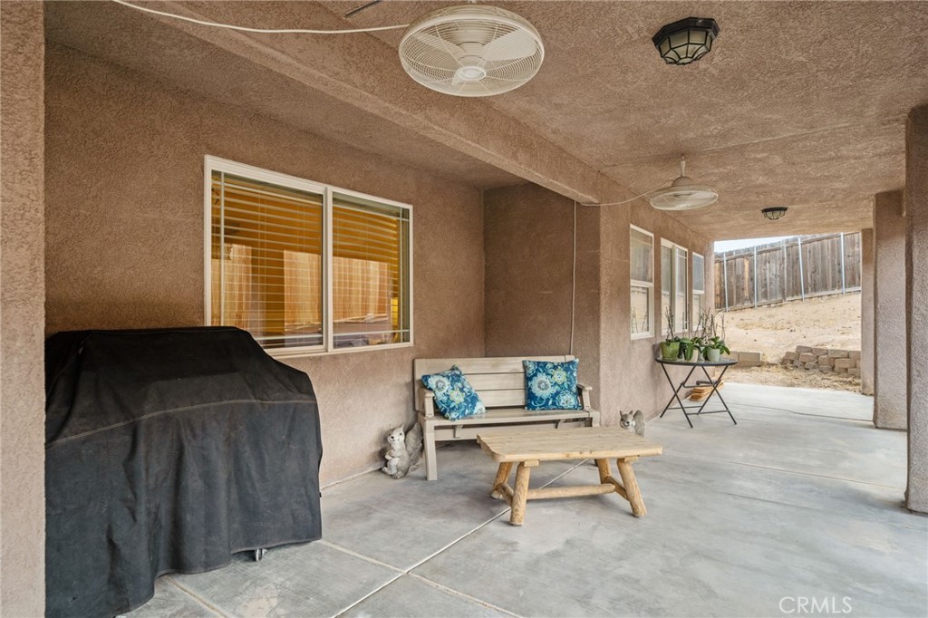7575 Rancho Road Pinon Hills, CA 92397 - Photo 31 of 38 a living room with furniture and a window