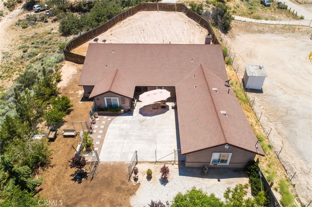 7575 Rancho Road Pinon Hills, CA 92397 - Photo 33 of 38 an aerial view of a house with a yard