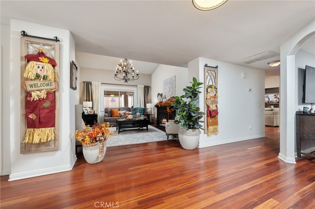 7575 Rancho Road Pinon Hills, CA 92397 - Photo 7 of 38 a view of a livingroom with dining room and wooden floor