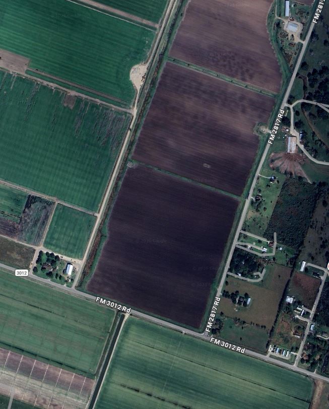 a view of a backyard with sitting area