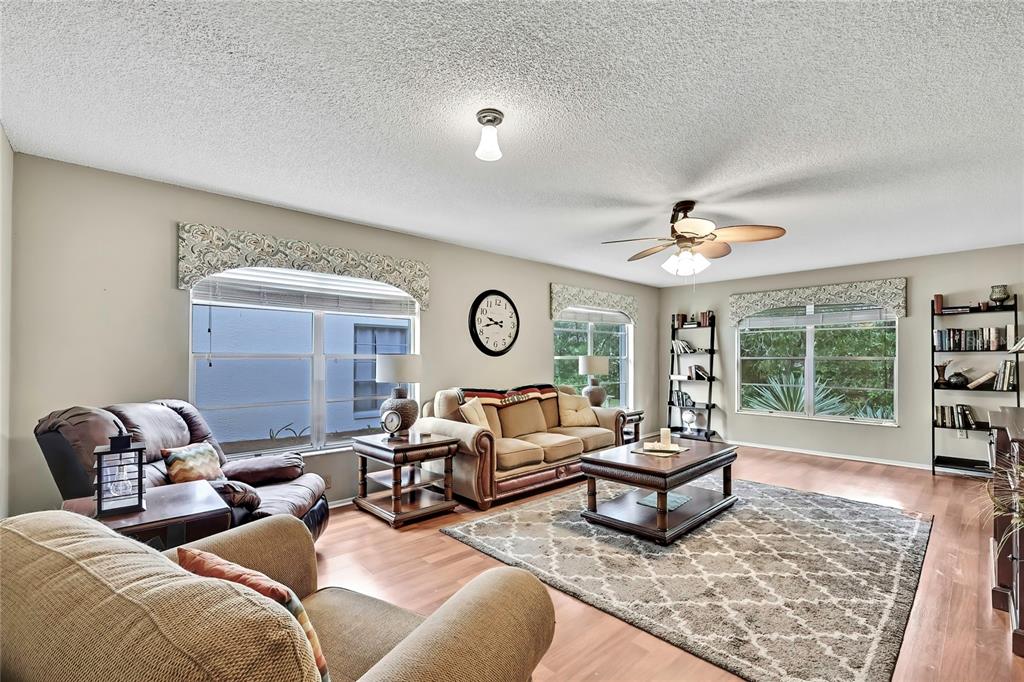 6517 Ocean Pines Lane Spring Hill, FL 34606 - Photo 17 of 72 a living room with furniture and a window