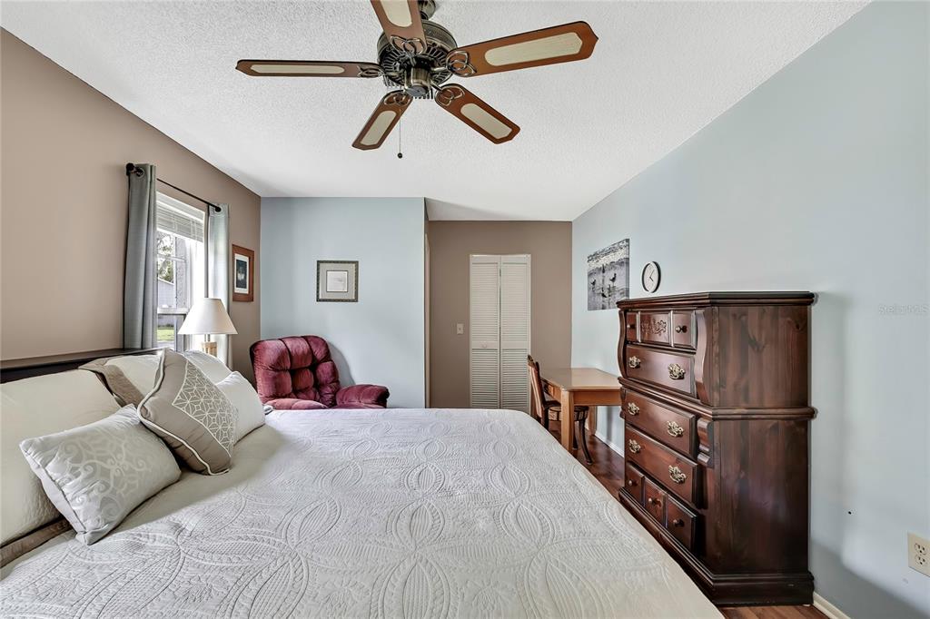 6517 Ocean Pines Lane Spring Hill, FL 34606 - Photo 19 of 72 a bedroom with a bed and a refrigerator