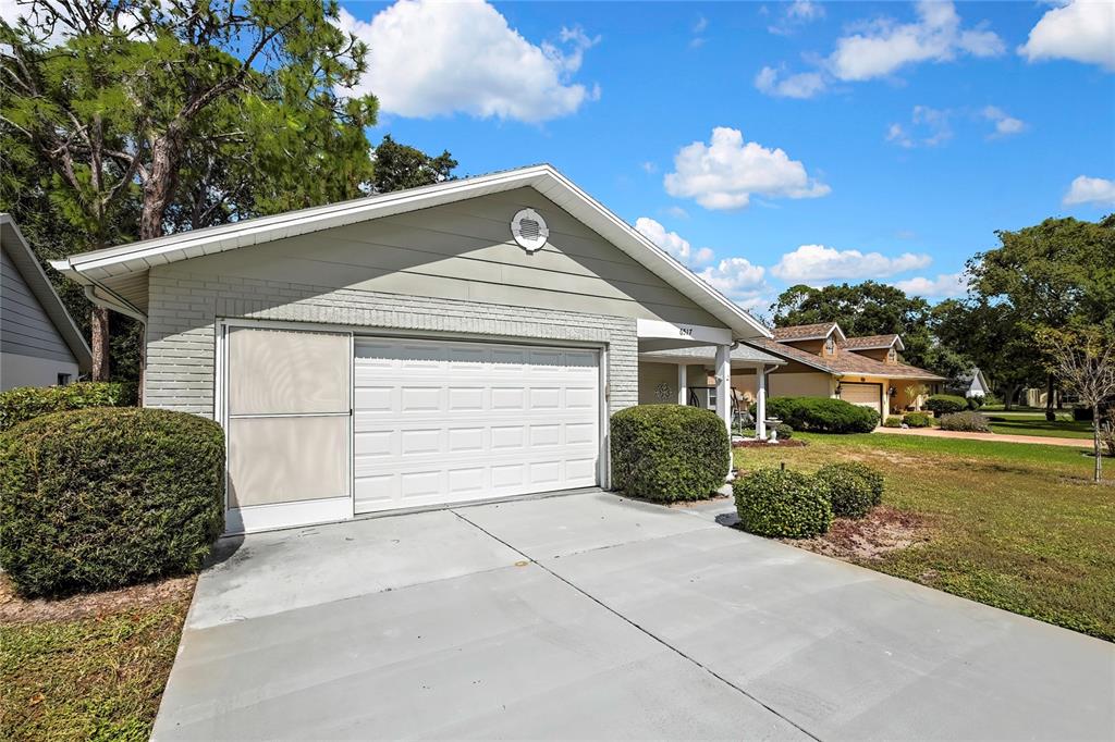 6517 Ocean Pines Lane Spring Hill, FL 34606 - Photo 37 of 72 a view of a house with a yard