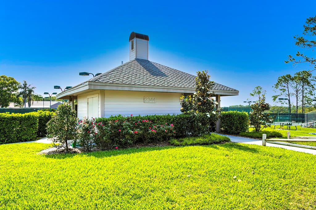 6517 Ocean Pines Lane Spring Hill, FL 34606 - Photo 61 of 72 a front view of a house with garden