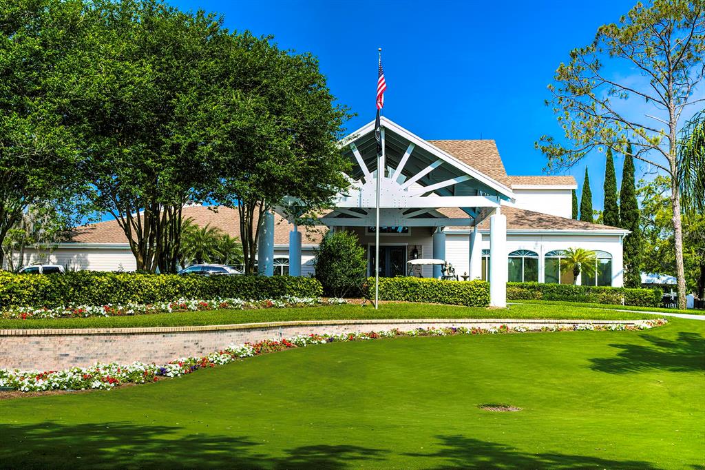 6517 Ocean Pines Lane Spring Hill, FL 34606 - Photo 63 of 72 a front view of a house with a yard table and chairs