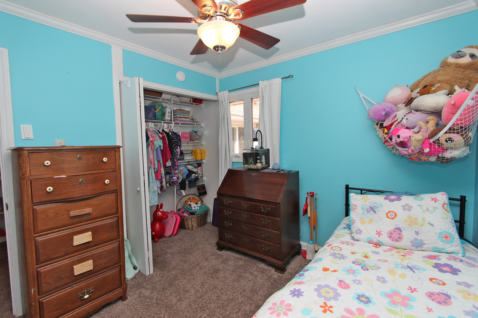 43 Golfview Road Lake Zurich, IL 60047 - Photo 21 of 35 a bedroom with a bed and a chandelier