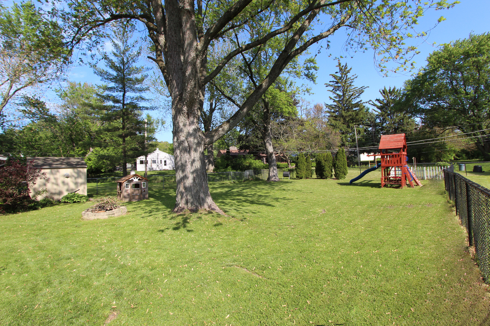 43 Golfview Road Lake Zurich, IL 60047 - Photo 25 of 35 a view of a park with swings and a slide