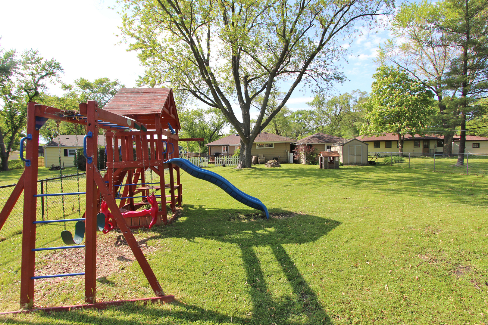 43 Golfview Road Lake Zurich, IL 60047 - Photo 27 of 35 a view of a swimming pool with a bench and trees