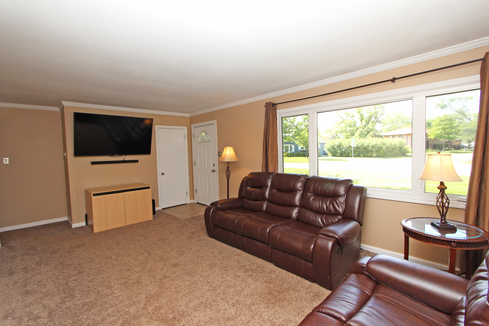 43 Golfview Road Lake Zurich, IL 60047 - Photo 4 of 35 a living room with furniture and a flat screen tv