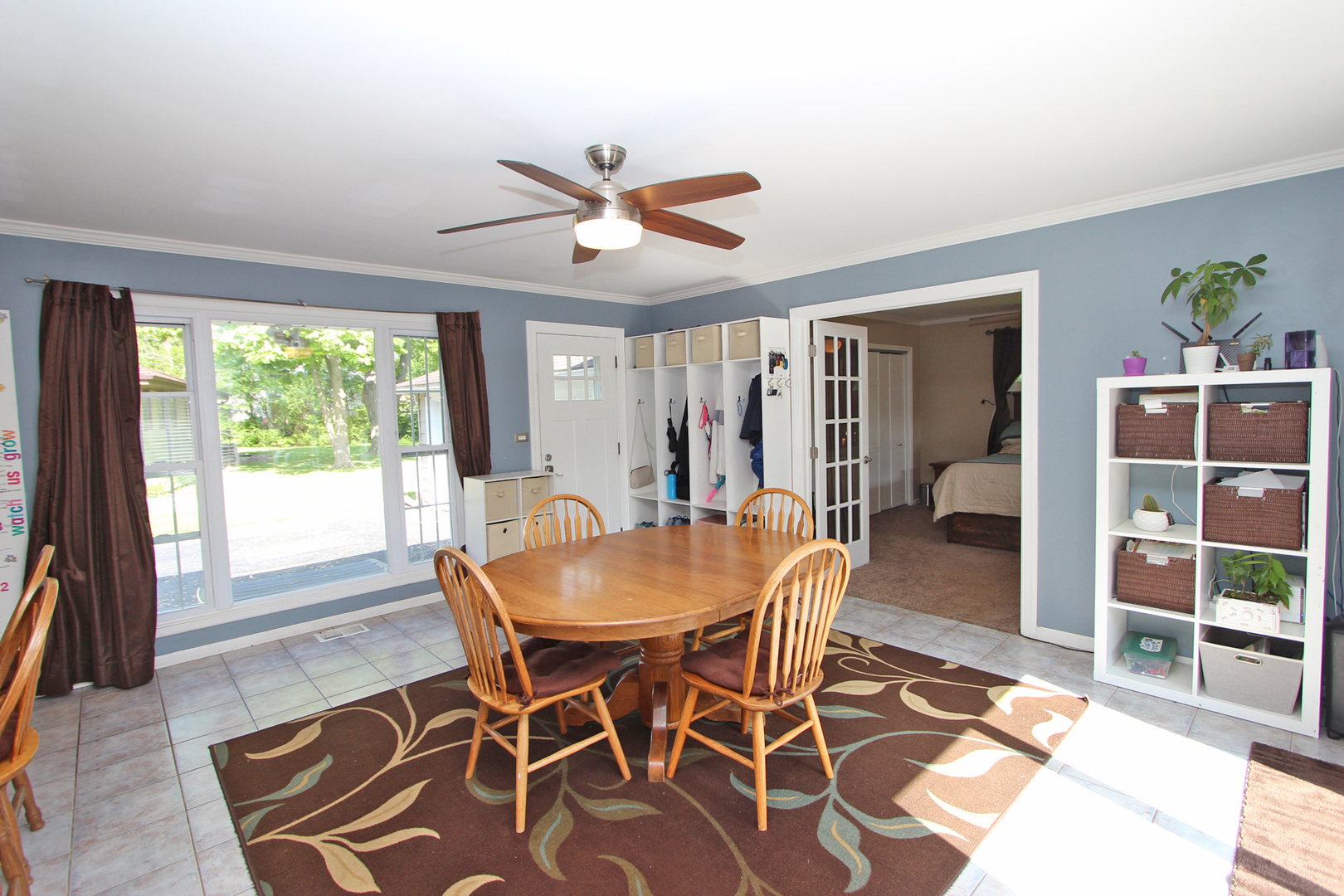 43 Golfview Road Lake Zurich, IL 60047 - Photo 9 of 35 a dining room with furniture large window and wooden floor