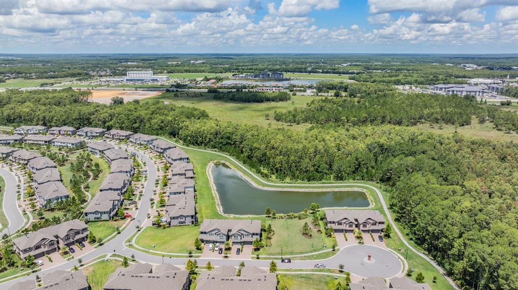 4849 Isola Court Wesley Chapel, FL 33543 - Photo 3 of 12 a view of a city with a lake view