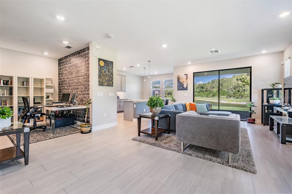 4849 Isola Court Wesley Chapel, FL 33543 - Photo 4 of 12 a living room with furniture and a large window