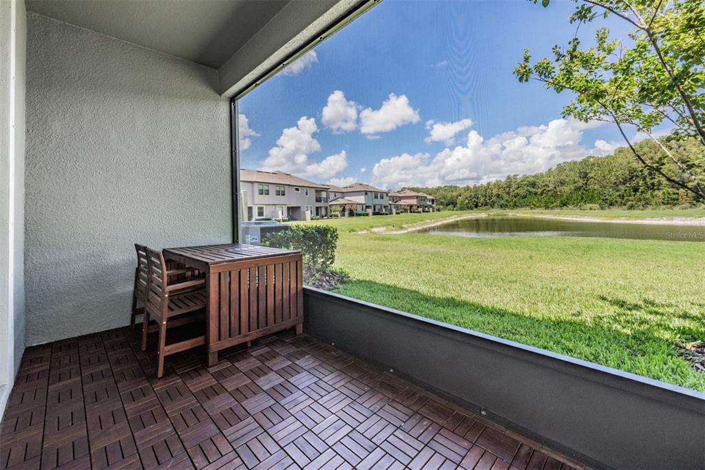 4849 Isola Court Wesley Chapel, FL 33543 - Photo 10 of 12 a view of a balcony with lake view