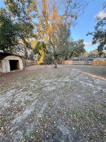 a view of backyard with outdoor space