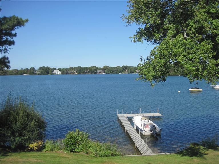 109 Old Farm Road Centerville, MA 02632 - Photo 3 of 26 a view of an ocean with a mountain in the background