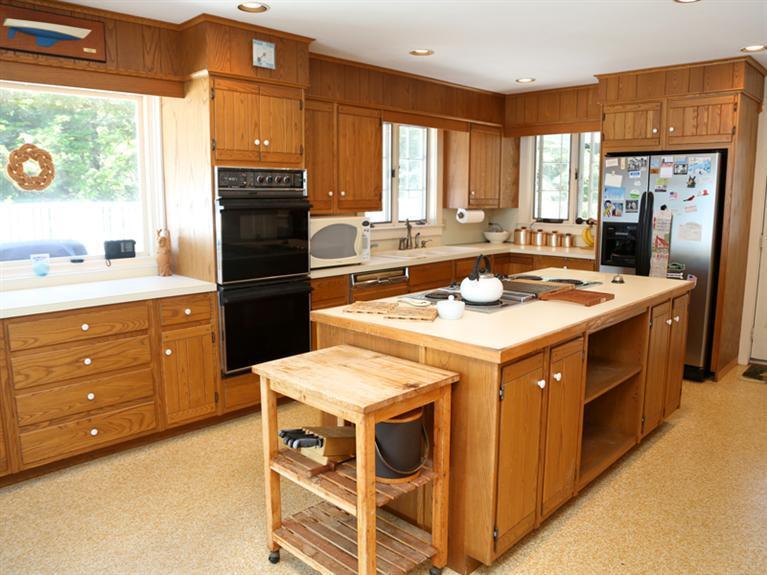 109 Old Farm Road Centerville, MA 02632 - Photo 7 of 26 a kitchen with a stove a sink a refrigerator and a window