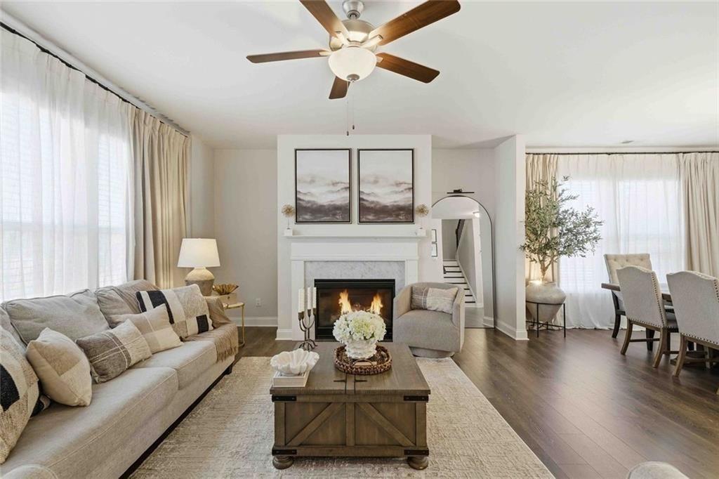 4631 Leader Lane Duluth, GA 30096 - Photo 15 of 55 a living room with furniture and a fireplace