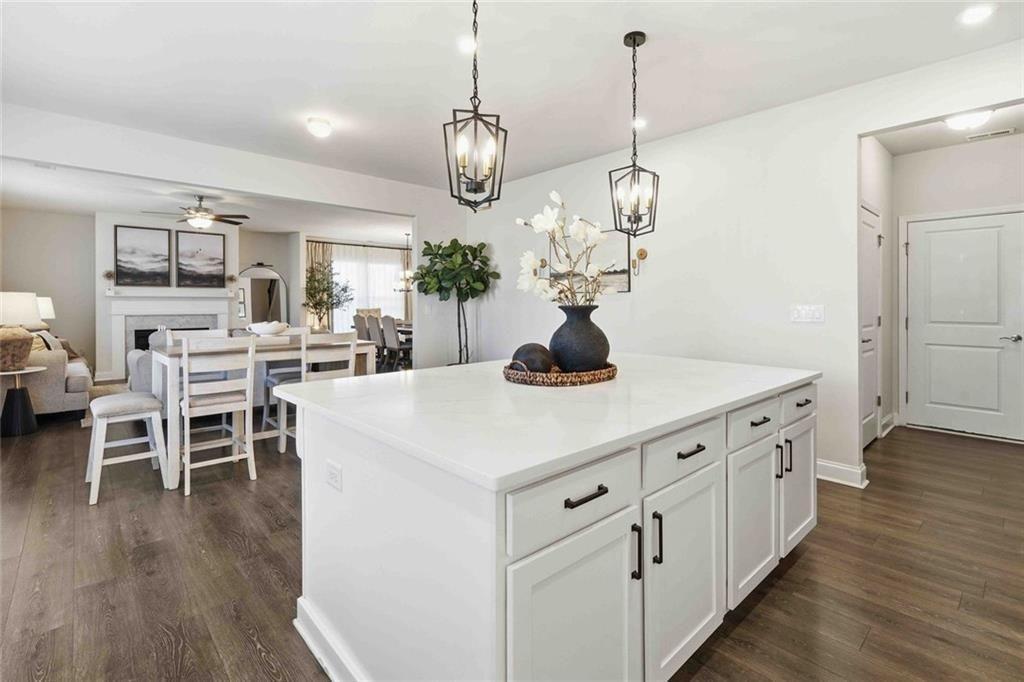 4631 Leader Lane Duluth, GA 30096 - Photo 20 of 55 a kitchen with a dining table chairs and wooden floor
