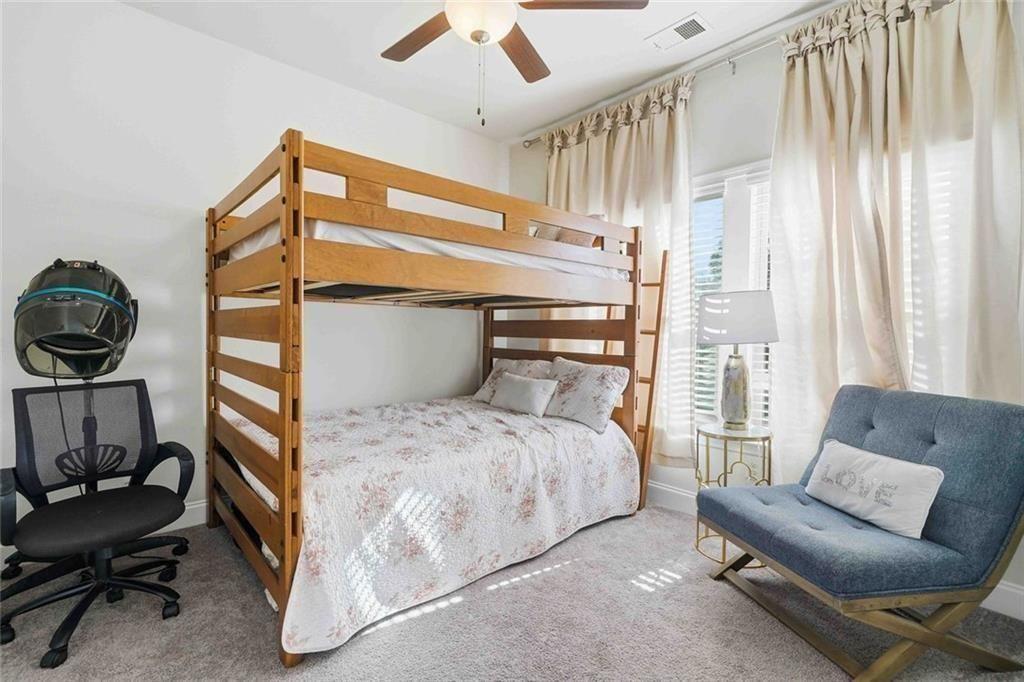 4631 Leader Lane Duluth, GA 30096 - Photo 27 of 55 a bedroom with a bed chair and window