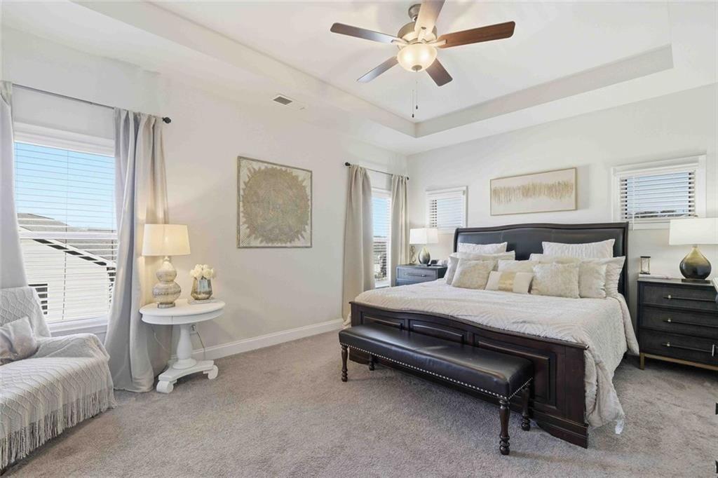 4631 Leader Lane Duluth, GA 30096 - Photo 31 of 55 a bedroom with a bed and a couch