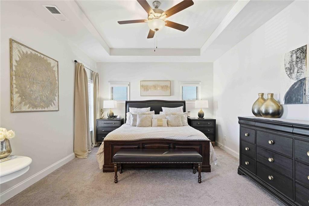 4631 Leader Lane Duluth, GA 30096 - Photo 32 of 55 a bedroom with a bed and ceiling fan