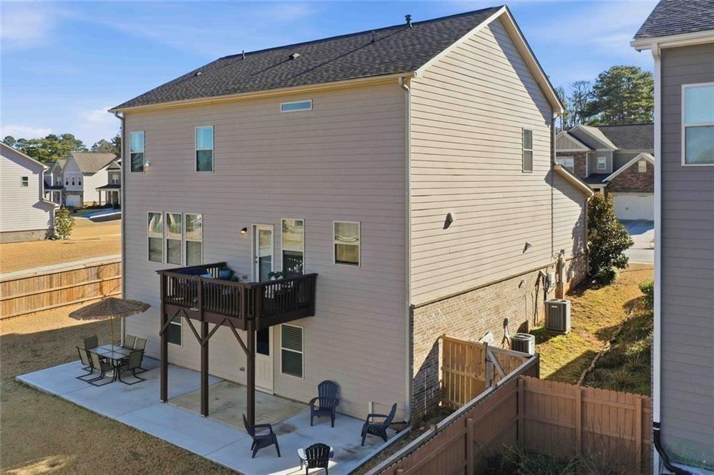 4631 Leader Lane Duluth, GA 30096 - Photo 49 of 55 a view of a house with backyard and sitting area