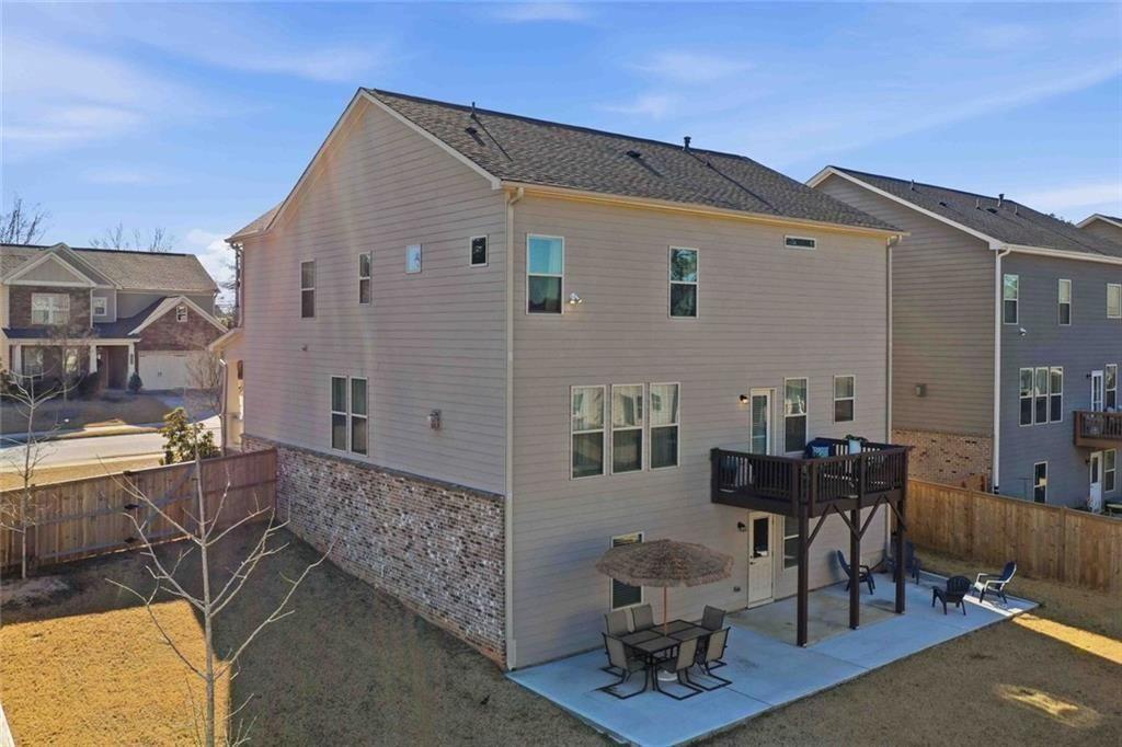 4631 Leader Lane Duluth, GA 30096 - Photo 50 of 55 a large brick building with a table and chairs