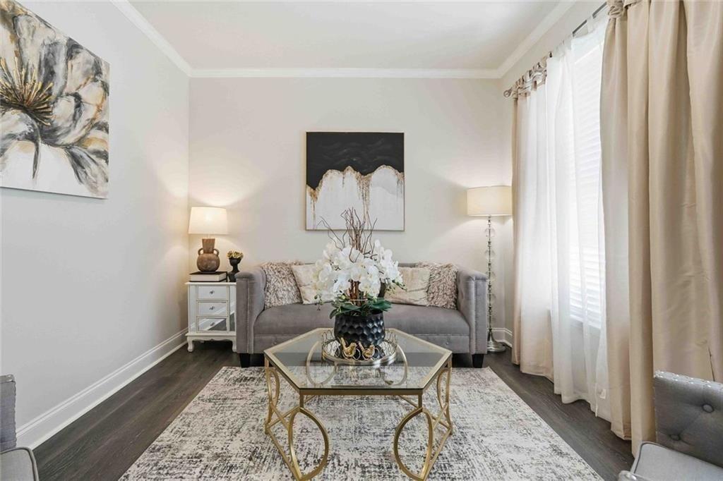 4631 Leader Lane Duluth, GA 30096 - Photo 6 of 55 a living room with furniture and a chandelier