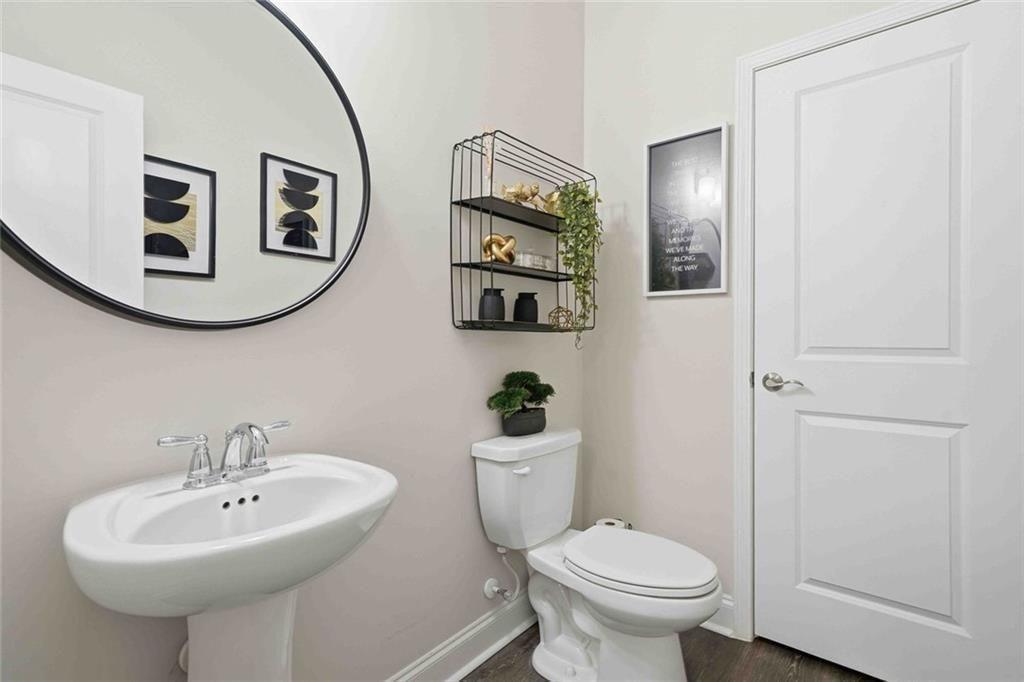 4631 Leader Lane Duluth, GA 30096 - Photo 8 of 55 a bathroom with a toilet sink and mirror