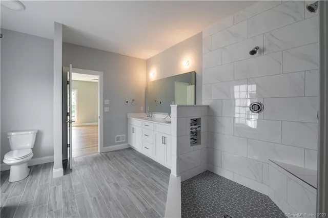 a bathroom with a sink and a large mirror