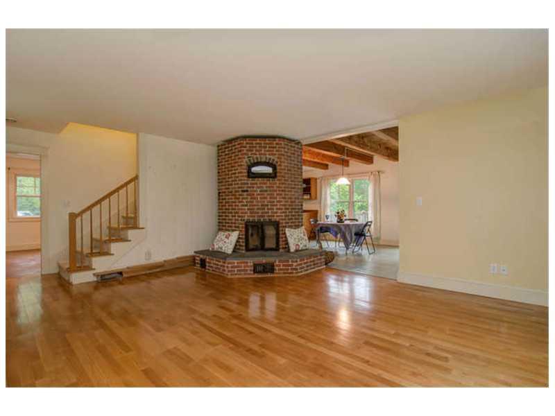 173 Wolfe's Neck Road Freeport, ME 04032 - Photo 11 of 35 Living Room. The masonry wood heater...