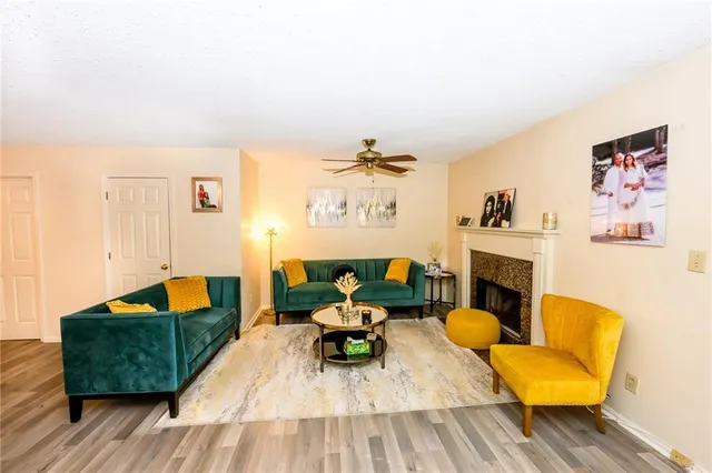 a living room with furniture and a fireplace