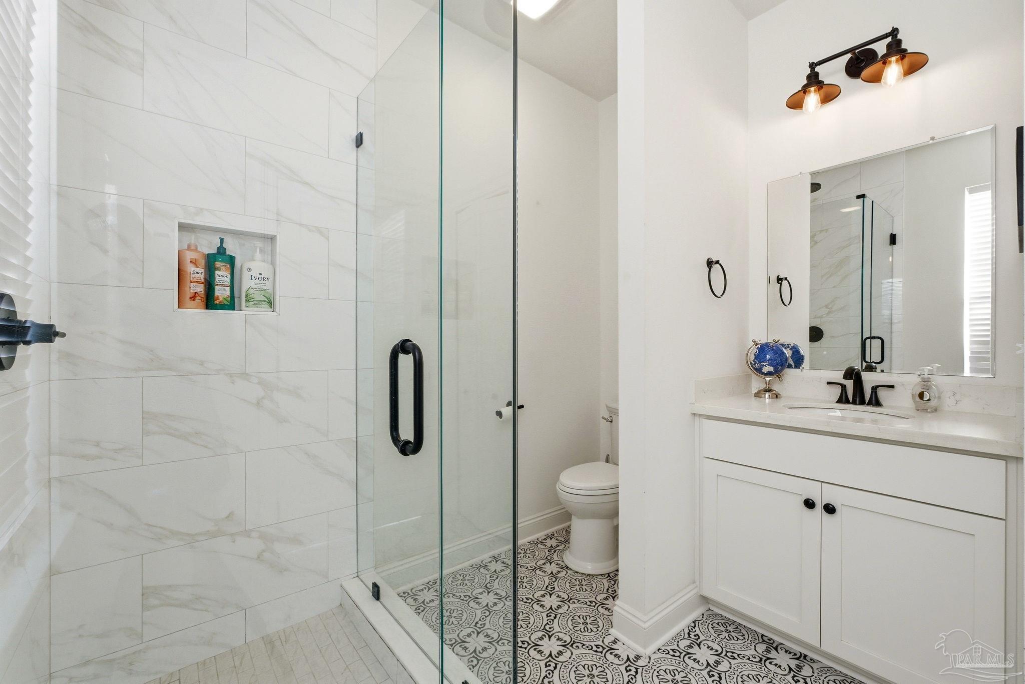 714 East La Rua Street Pensacola, FL 32501 - Photo 44 of 63 a bathroom with a sink toilet and shower