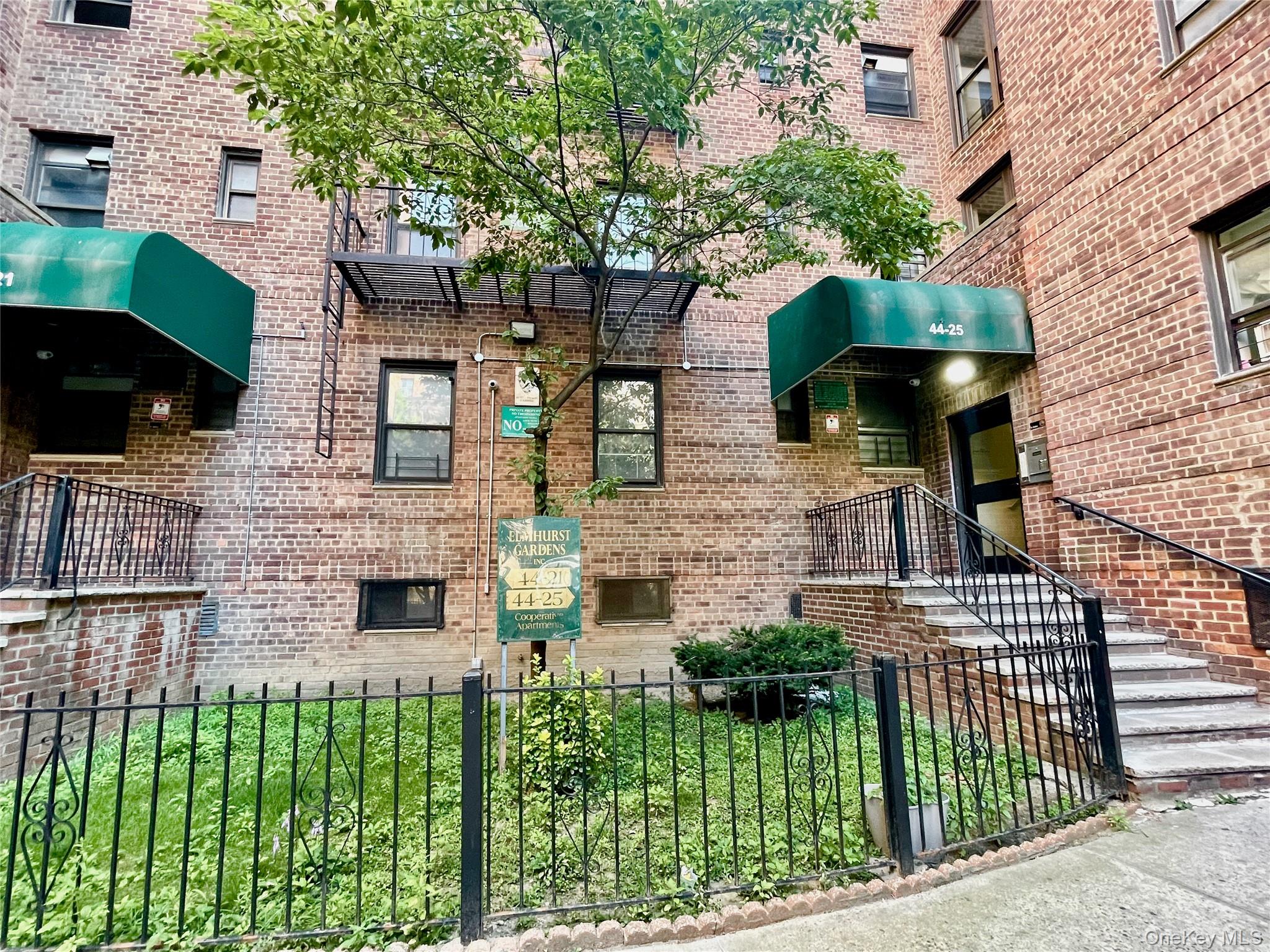 44-25 Macnish Street, Unit 5B Queens, NY 11373 - Photo 2 of 19 a front view of a house with a garden