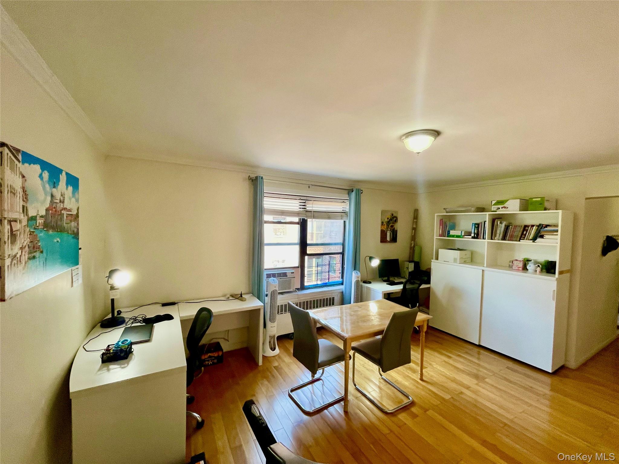 44-25 Macnish Street, Unit 5B Queens, NY 11373 - Photo 5 of 19 a workspace with wooden floor