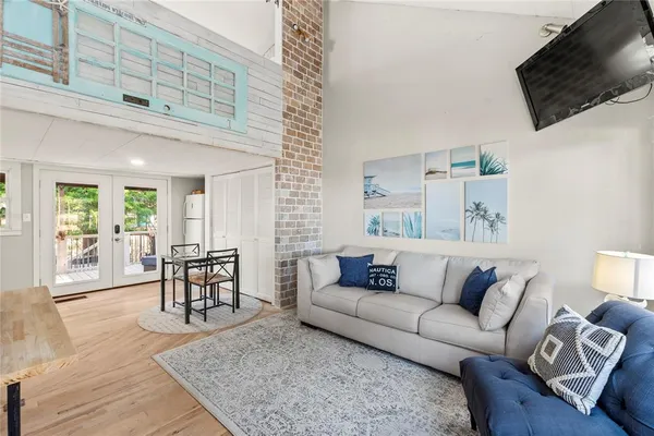 a living room with furniture and a flat screen tv