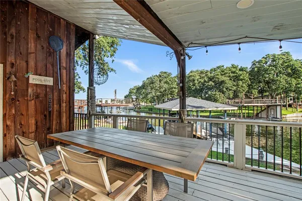 a view of a chairs and table in the balcony