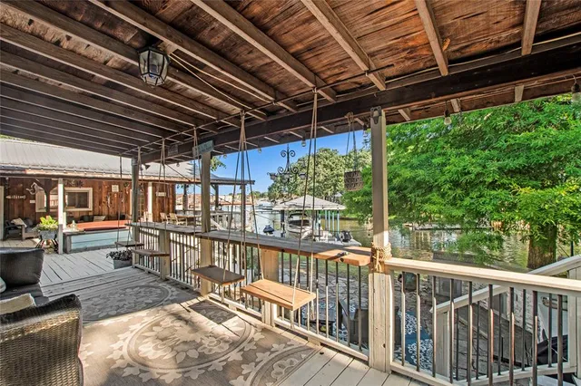 a view of a balcony with chairs
