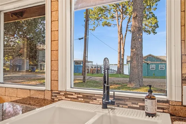 a view of a living room filled with furniture