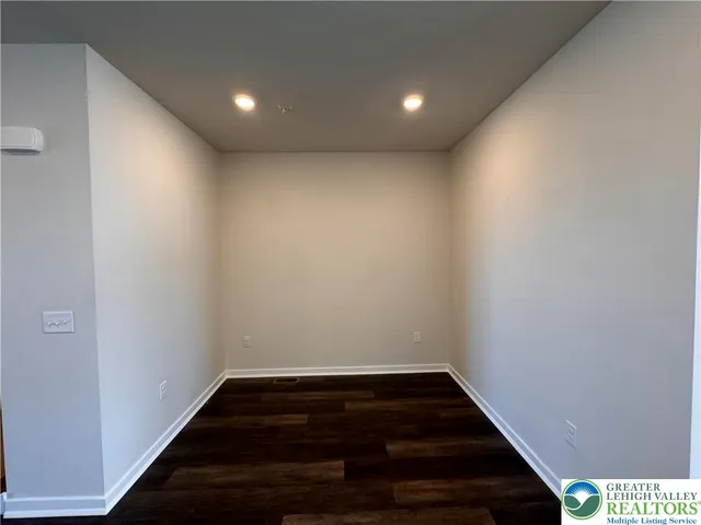 a view of small space with wooden floor and staircase