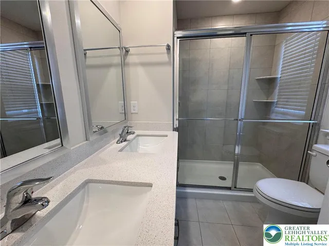 a bathroom with a sink and toilet